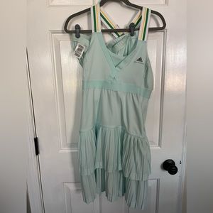 Adidas tennis dress with short mint green used like new. Few small marks size 44